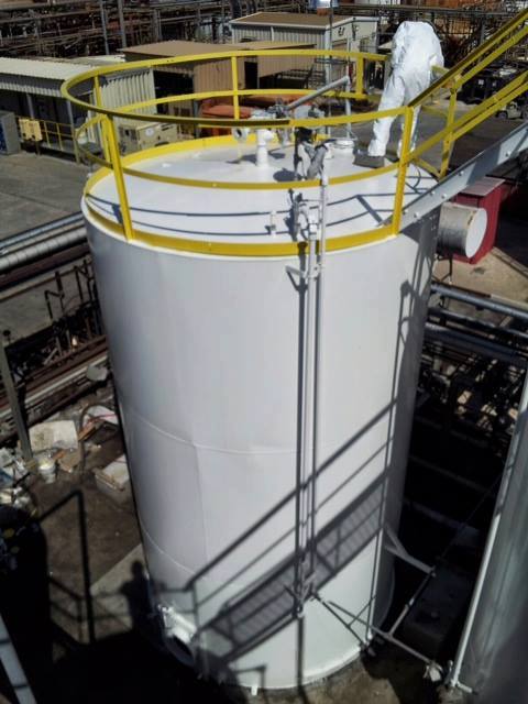 Valu Industrial crew applying protective coating to a storage tank on-site